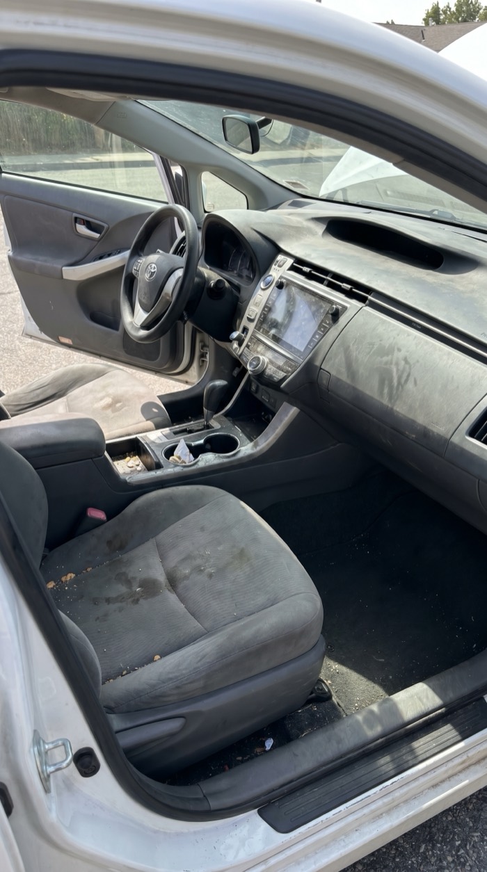 Car interior before and after detailing — before